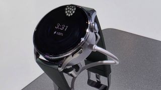The Xiaomi Watch 5 on a stand.