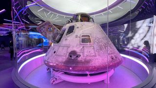 closeup view of a white space capsule on display in a museum