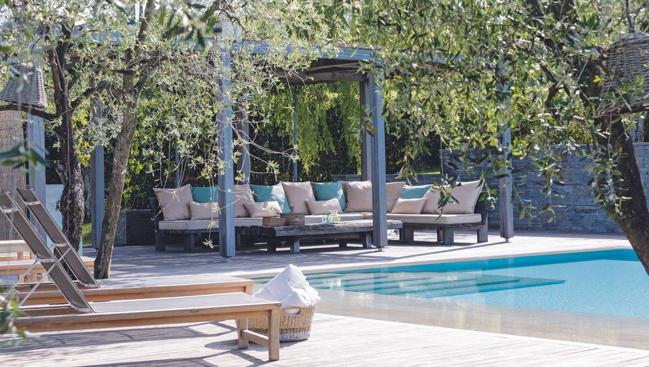 Outdoor space with pool and seating