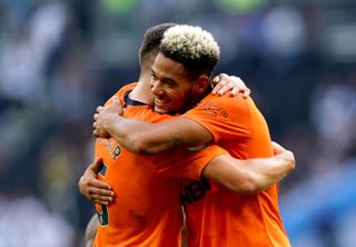 Newcastle's Joelinton celebrated with team-mate Fabian Schar after beating Tottenham
