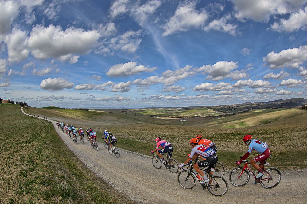 Riders make their way along the gravel roads at Strade Bianche