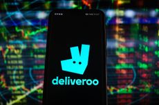 Deliveroo logo seen displayed on a smartphone with stock market percentages 