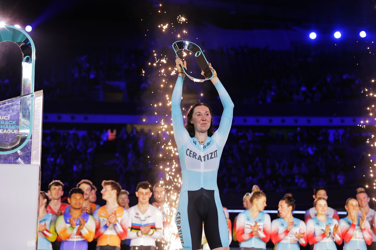 Katie Archibald lifts her winner&#039;s trophy at the UCI Track Champions League