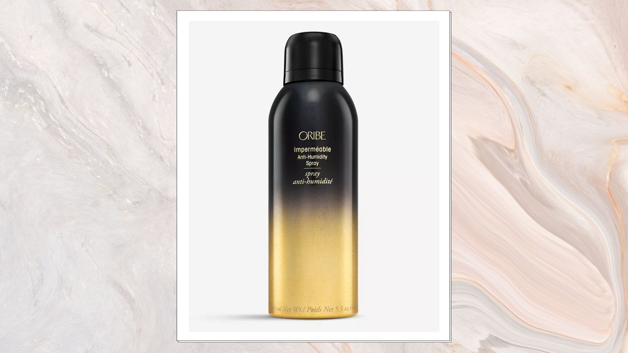 Image of Oribe Impermeable Spray on a white marbled background