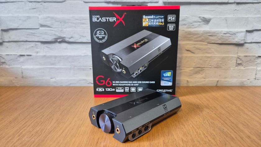 The Creative Sound BlasterX G6 USB sound card on a wooden surface