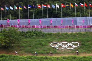 IZU JAPAN JULY 26 LR A general view of the peloton ride during the Mens Crosscountry race on day three of the Tokyo 2020 Olympic Games at Izu Mountain Bike Course on July 26 2021 in Izu Shizuoka Japan Photo by Tim de WaeleGetty Images