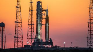 The sunrise casts a warm glow around the Artemis I Space Launch System (SLS) and Orion spacecraft at Launch Pad 39B at NASA’s Kennedy Space Center in Florida on March 21.