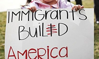 A young girl holds up a sign during a March protest of a Utah immigration bill.
