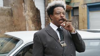 Russell Hornsby as Don King smoking a cigar in MIKE, the Hulu series