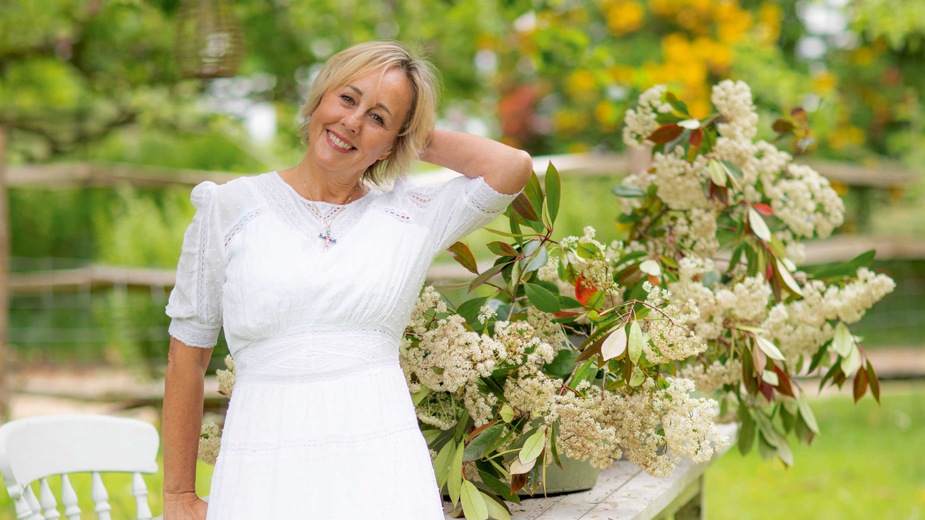 Shirlie Kemp in garden in white dress