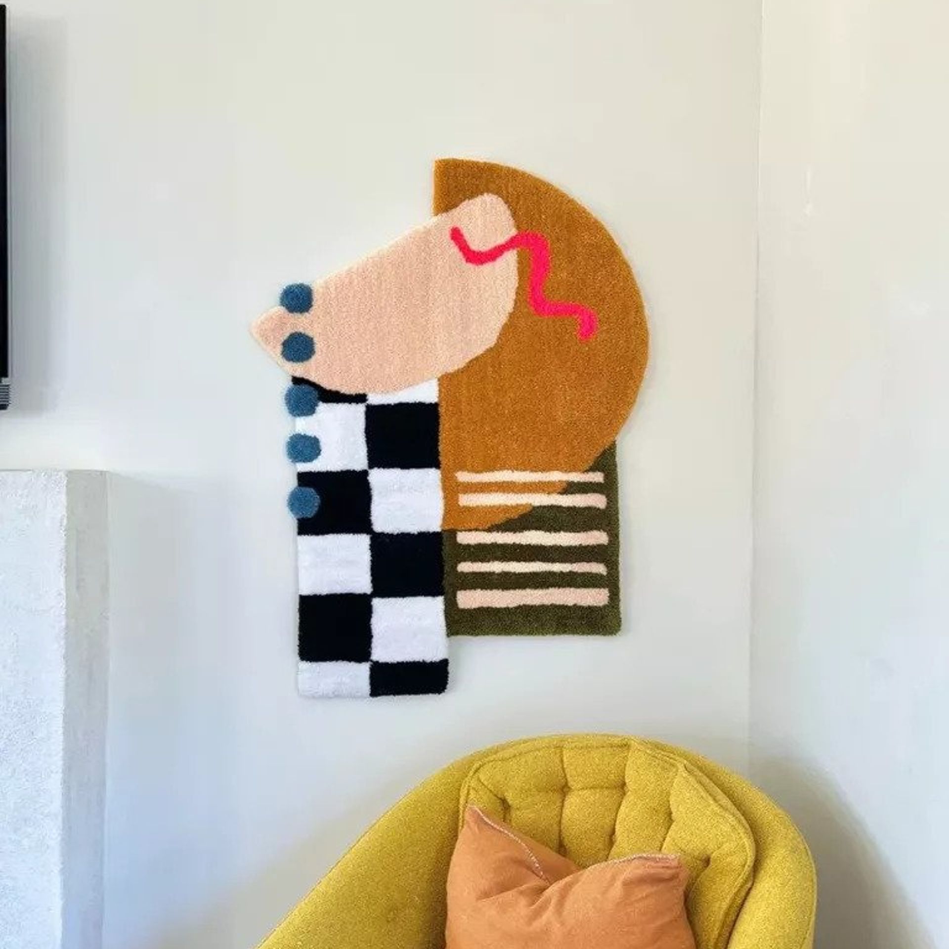 Tufted wall art in a white bedroom