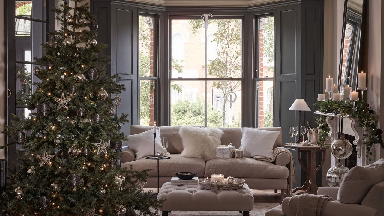 A Christmas-decorated living room with a Christmas tree