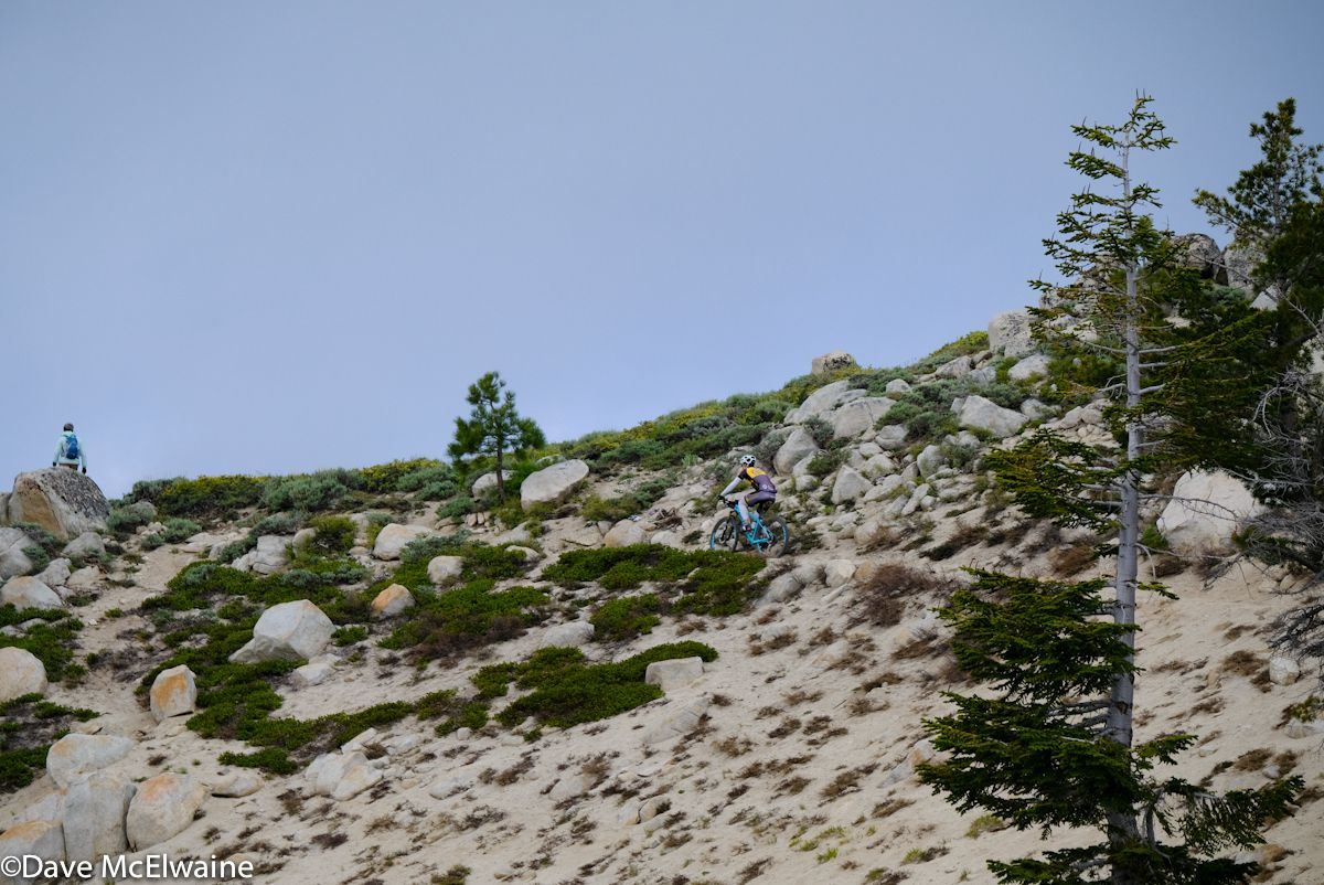 A rider crests one of the many climbs overlooking Lake Tahoe