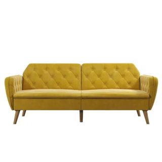 A yellow two-seater tufted button futon couch
