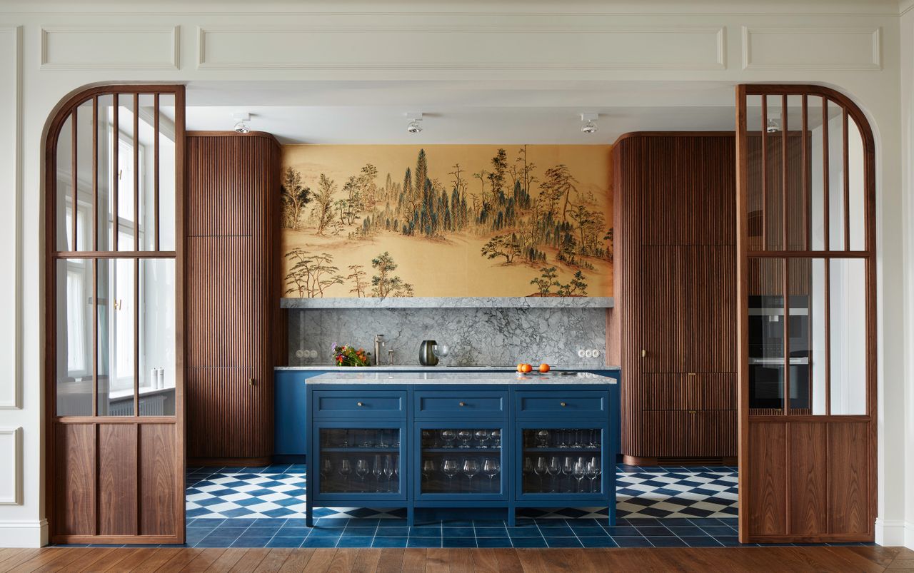 partitioned kitchen with large brown doors and glass panels 