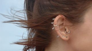 how to get rid of a headache fastillustrated with an image of a woman with a daith piercing