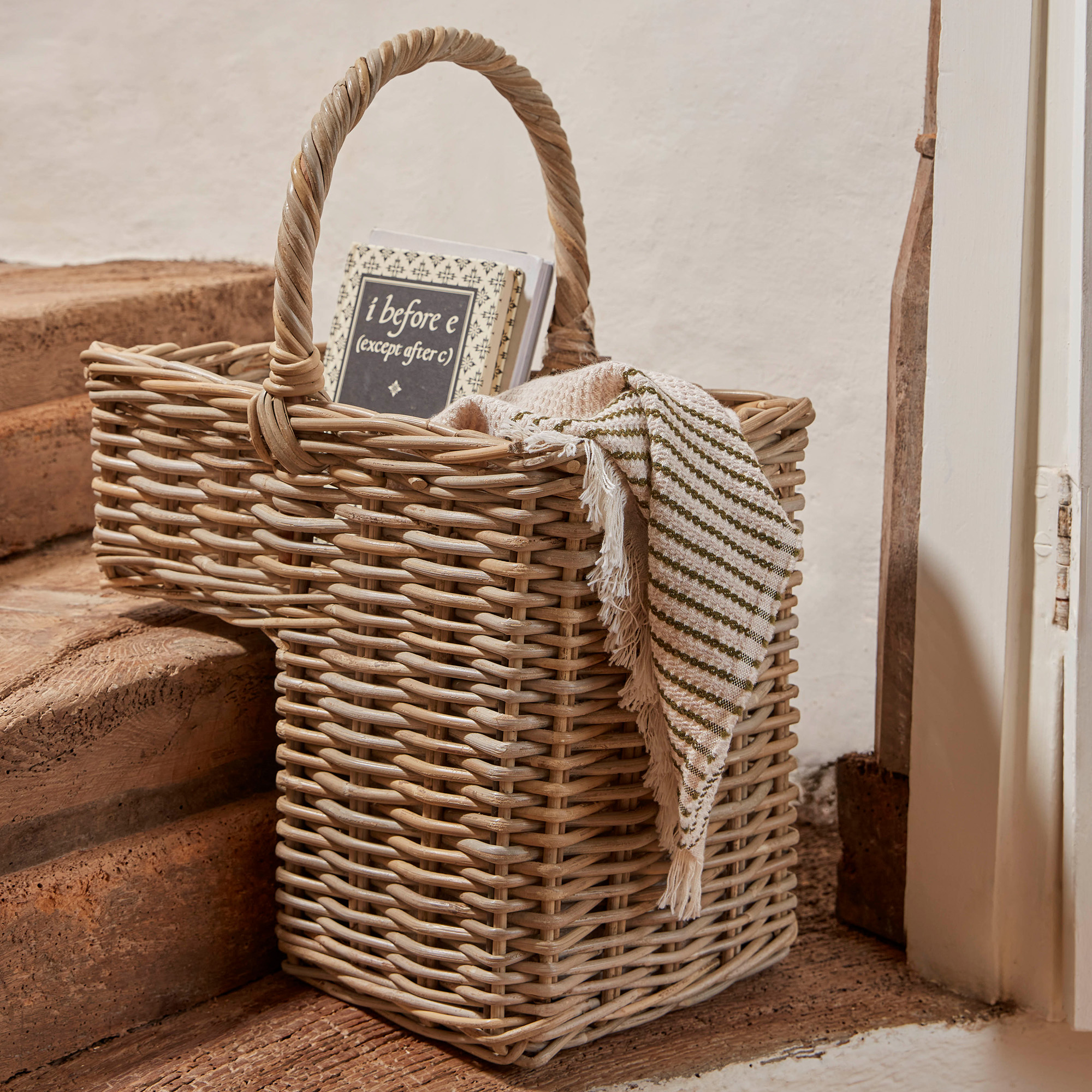 rattan stepped basket on stone stairs