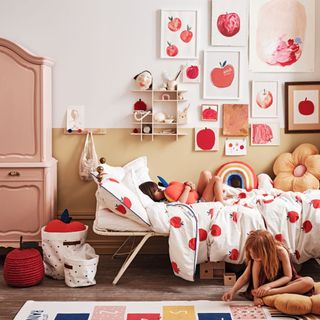 kids room with white walls and artwork on wall