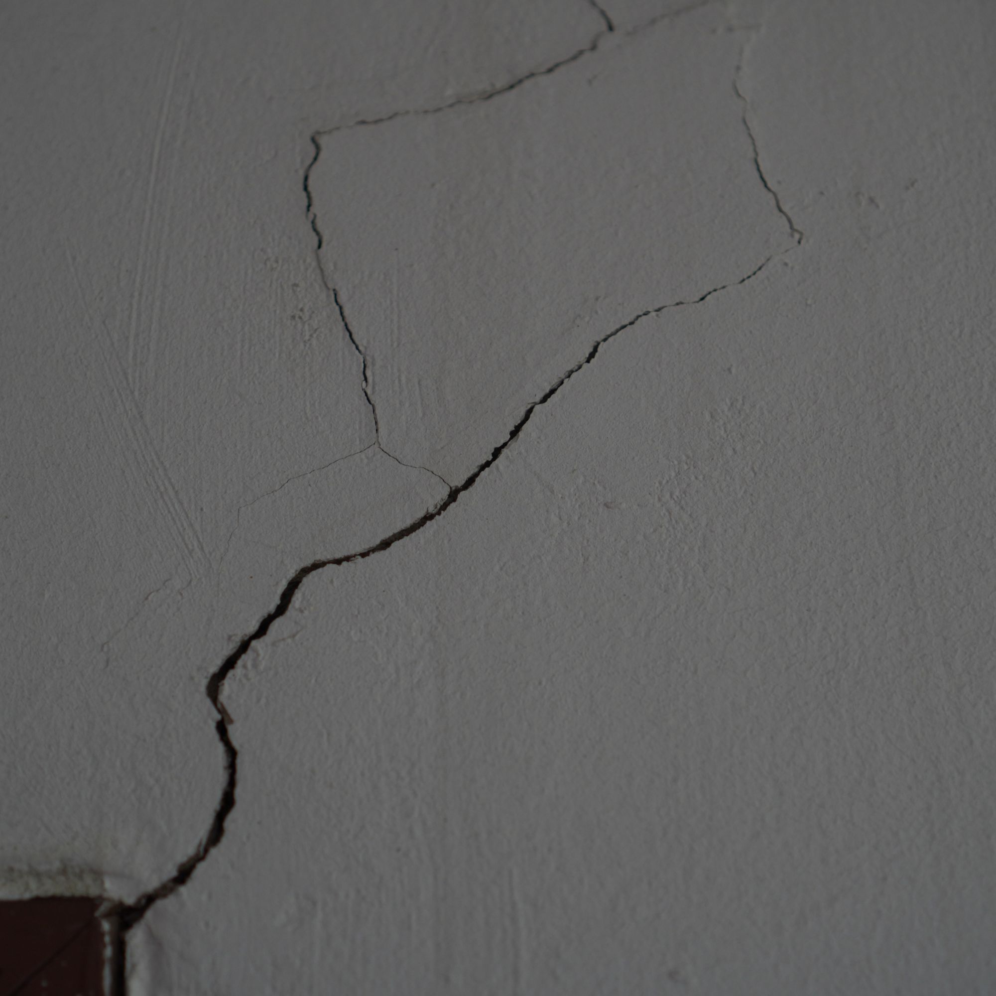 crack in wall coming from the corner of a doorway