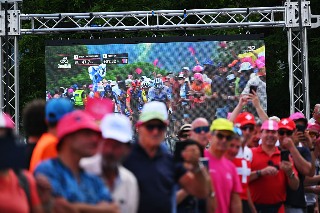 A screen shows to the breakaway compete during the 109th Giro d&amp;apos;Italia 2026, Stage 16