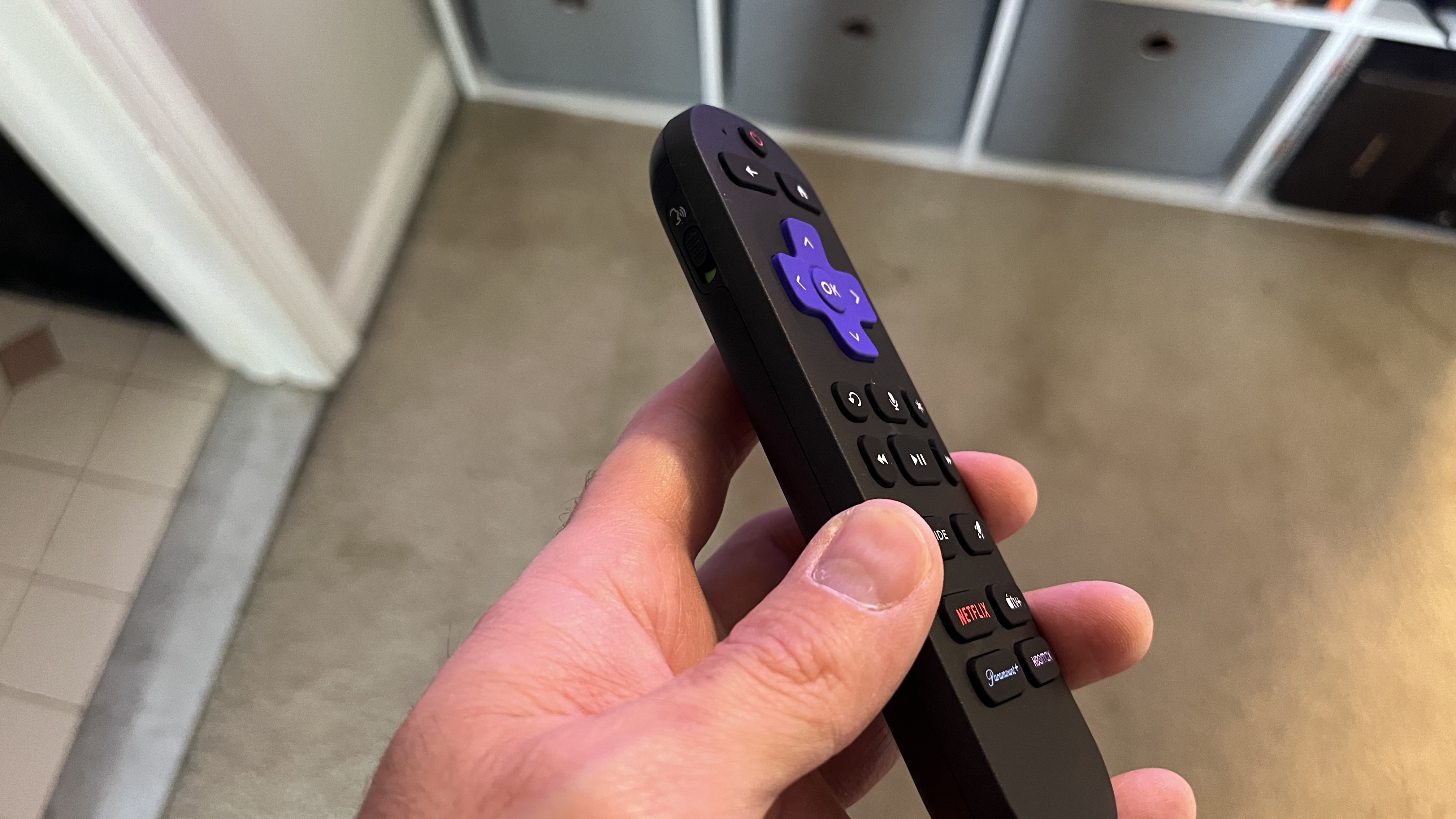 Roku Pro series remote control held in hand