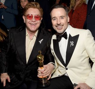 WEST HOLLYWOOD, CALIFORNIA - FEBRUARY 09: (L-R) Winner of Academy Award for Best Original Song from "Rocketman" Elton John and David Furnish attend the 28th Annual Elton John AIDS Foundation Academy Awards Viewing Party sponsored by IMDb, Neuro Drinks and Walmart on February 09, 2020 in West Hollywood, California. (Photo by Michael Kovac/Getty Images for EJAF)