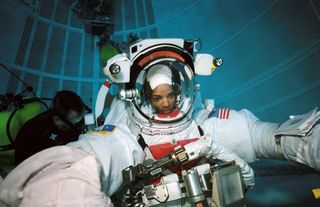 Shuttle Discovery: Spacewalking Trio Poised for Orbital Work