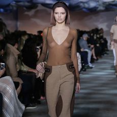 Clothing, Footwear, Human, Leg, Brown, Fashion show, Shoulder, Runway, Joint, Outerwear, 