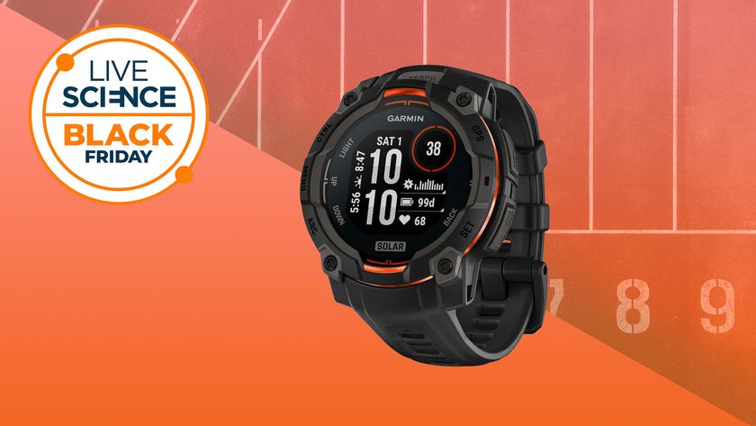 A Live Science Black Friday Deals logo and a stock picture of the Garmin Instinct 3 watch on an orange background