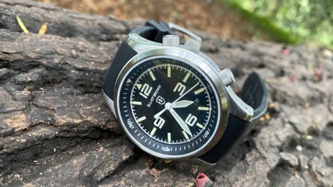 Elliot Brown Canford Mountain Rescue Edition watch: watch on a log