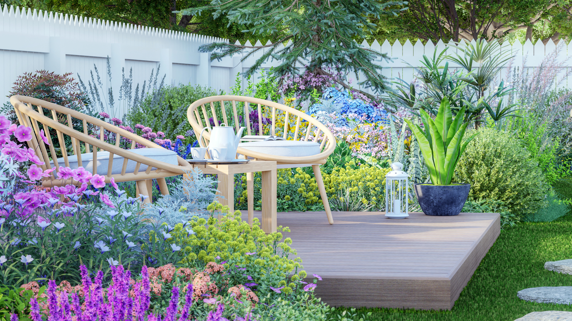 two chairs and a table on a small deck in a garden
