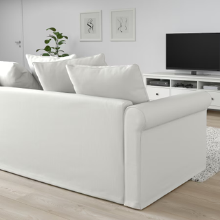 A white sofa bed pictured from behind