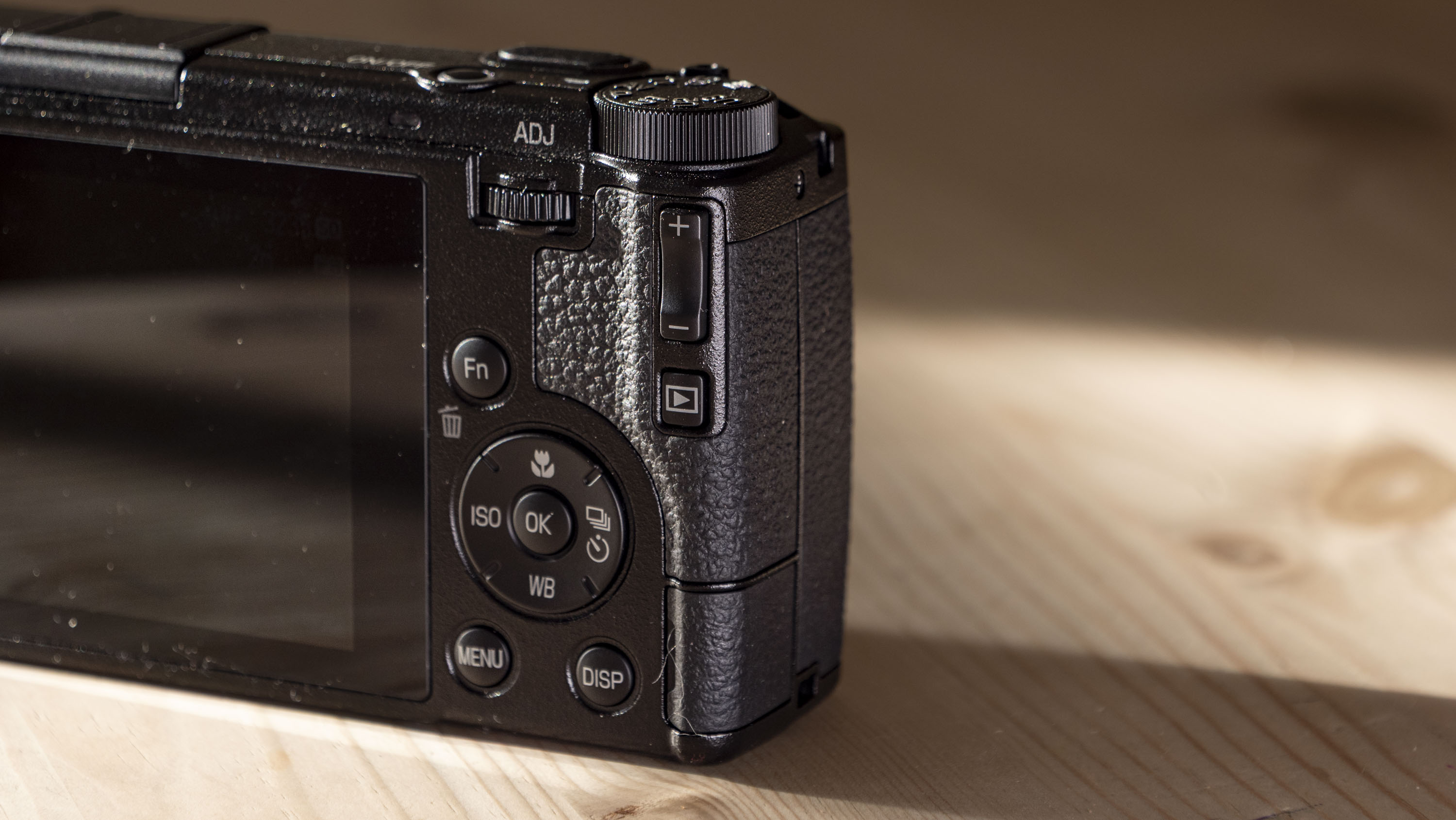 Closeup of the Ricoh GR IV compact camera's rear controls