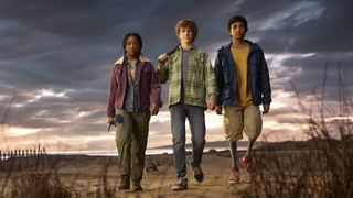 Image of Percy Jackson, Annabeth Chase and Grover Underwood from Percy Jackson series, walking on a beach