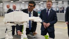 Rishi Sunak and Grant Shapps, Secretary of State for Energy Security and Net Zero, are shown a 3-D printed model of an All Terrain Armoured Transport walker from “Star Wars”