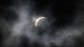 The partial phase of the April 8 solar eclipse seen through clouds above Syracuse, New York.