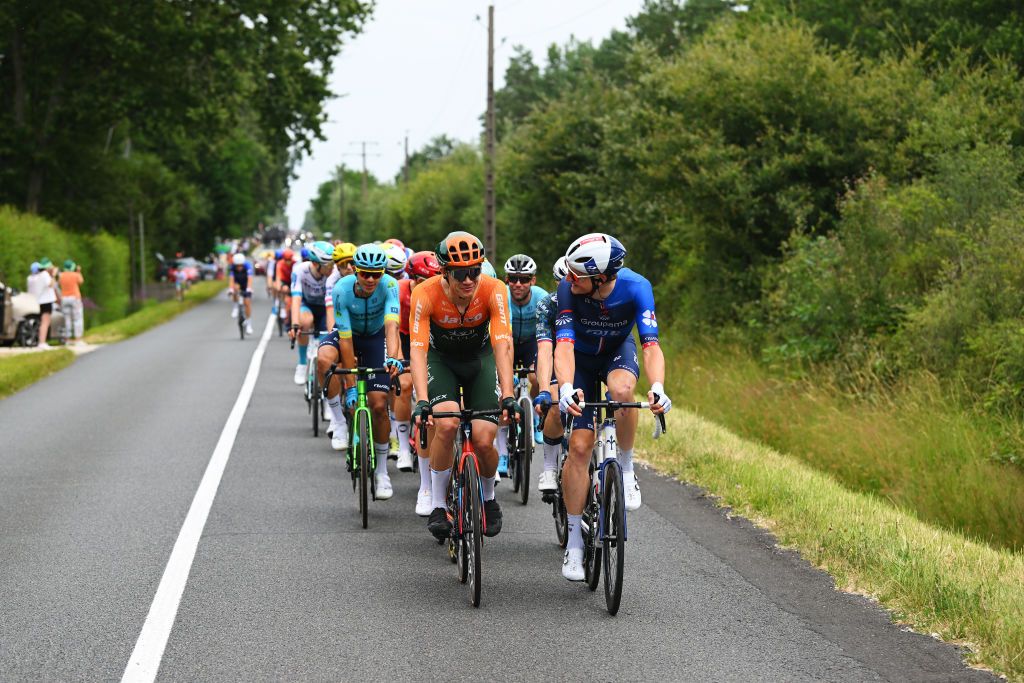 SAINTAMANDMONTROND FRANCE JULY 09 LR Chris JuulJensen of Denmark and Team Jayco AlUla and Stefan Kung of Switzerland and Team Groupama FDJ compete during the 111th Tour de France 2024 Stage 10 a 1873km stage from Orleans to SaintAmandMontrond UCIWT on July 09 2024 in Orleans France Photo by Dario BelingheriGetty Images
