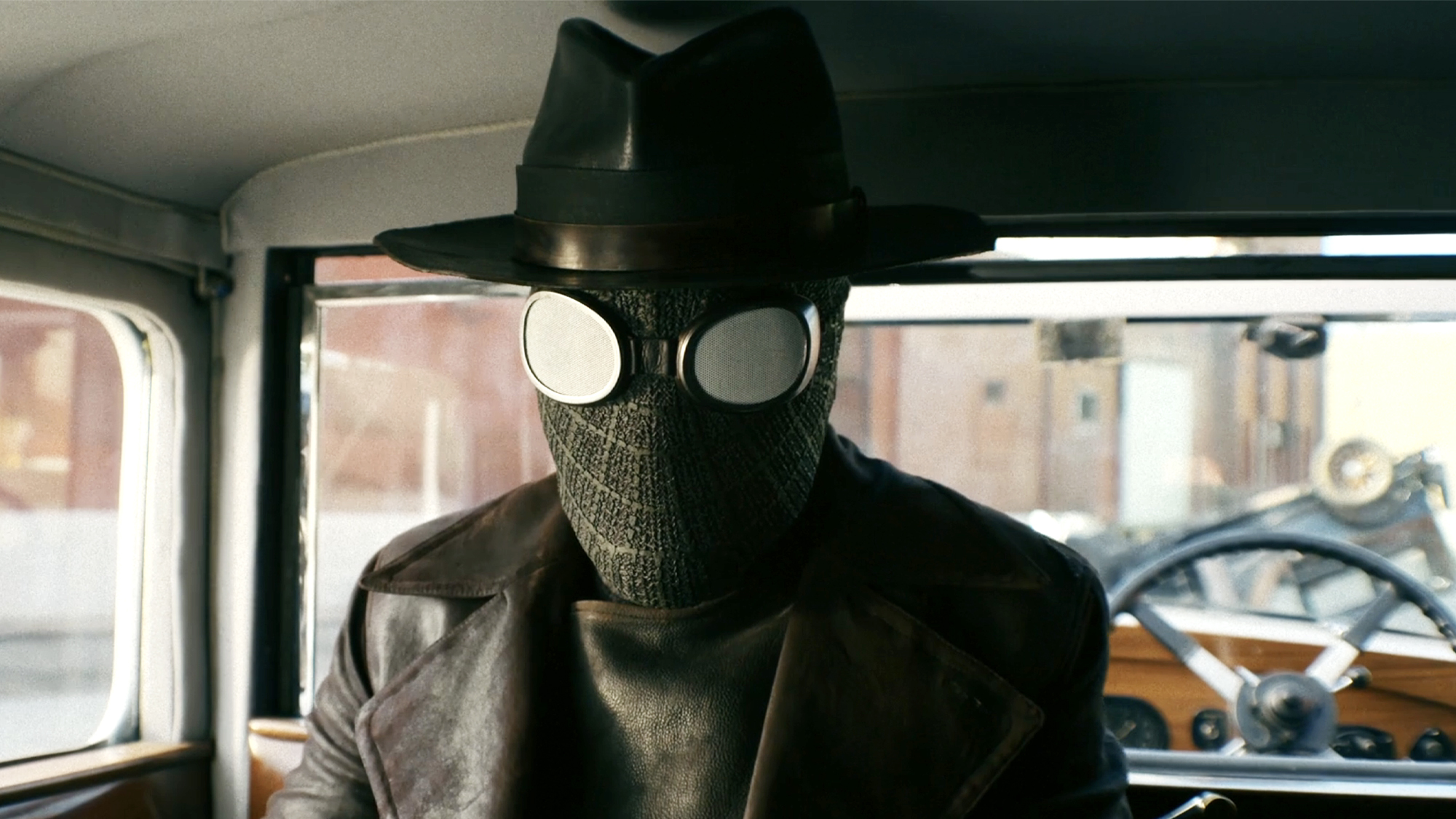 Nic Cage dressed as Spider-Noir, Black suit, long coat, and hat, in the show of the same name (2026).