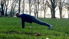 Fit&Well fitness writer Harry Bullmore performing a push-up as part of Harry Styles' bodyweight workout challenge