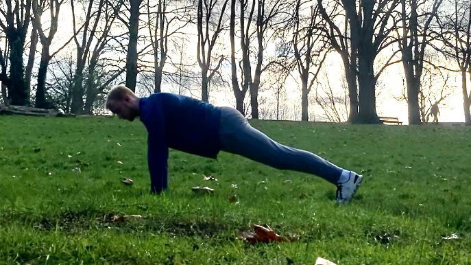 Fit&amp;Well fitness writer Harry Bullmore performing a push-up as part of Harry Styles&#039; bodyweight workout challenge