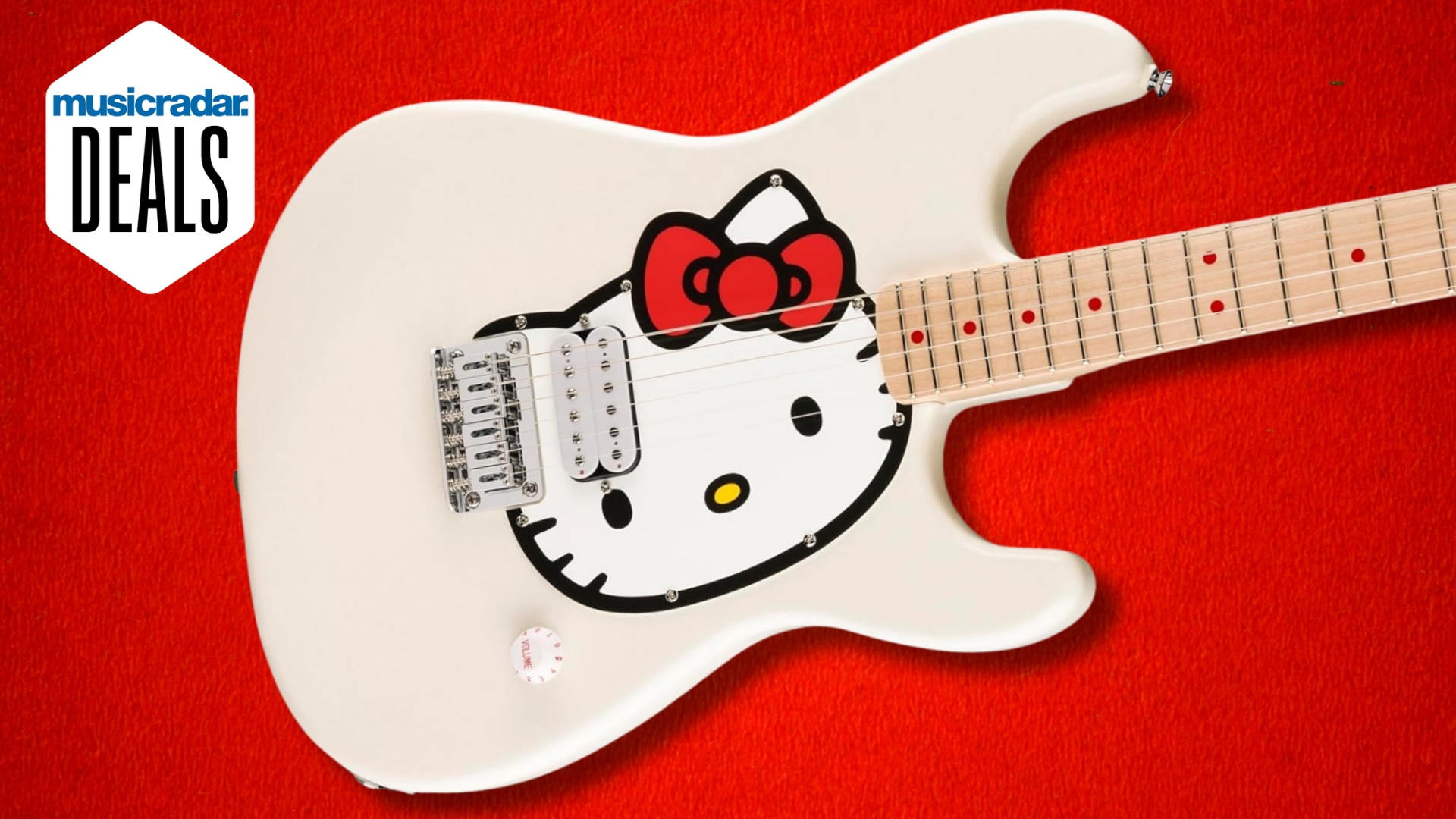 A Fender x Hello Kitty Stratocaster guitar on a red background