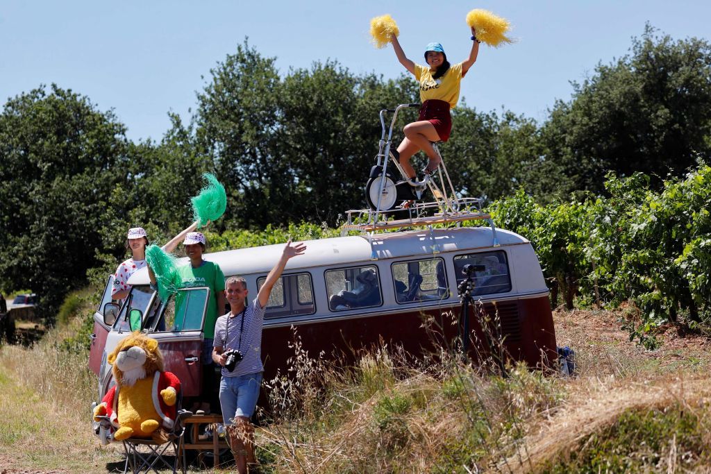 Fans cheer for the riders during the 13th stage of the 108th edition of the Tour de France cycling race 219 km between Nimes and Carcassonne on July 09 2021 Photo by Thomas SAMSON AFP Photo by THOMAS SAMSONAFP via Getty Images
