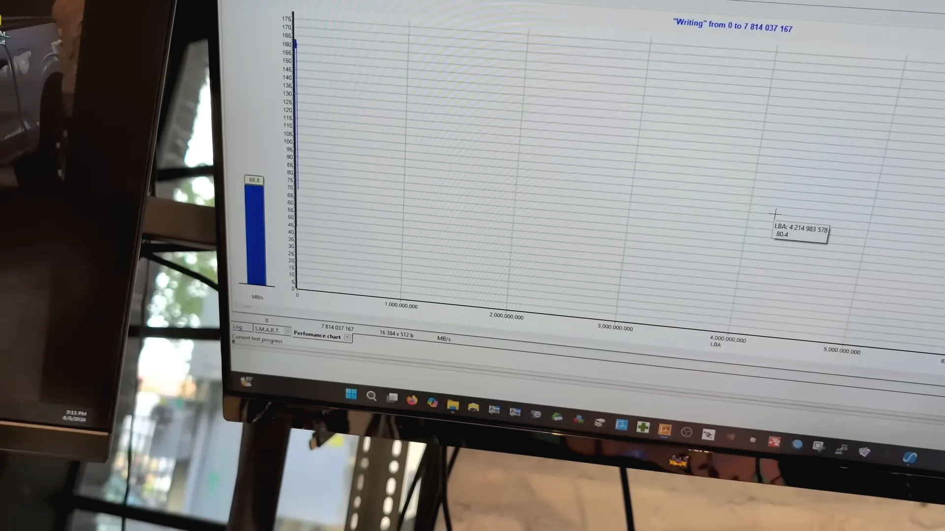 A screenshot of a YouTube video by Louis Rossmann, showing write speed figures for an SSD