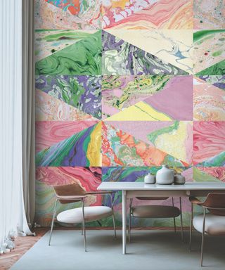 dining area with colourful marble patterned wallpaper behind