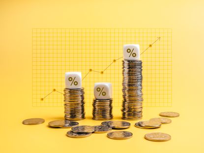 Percentage icons on white cube blocks on money coin stack as graph steps