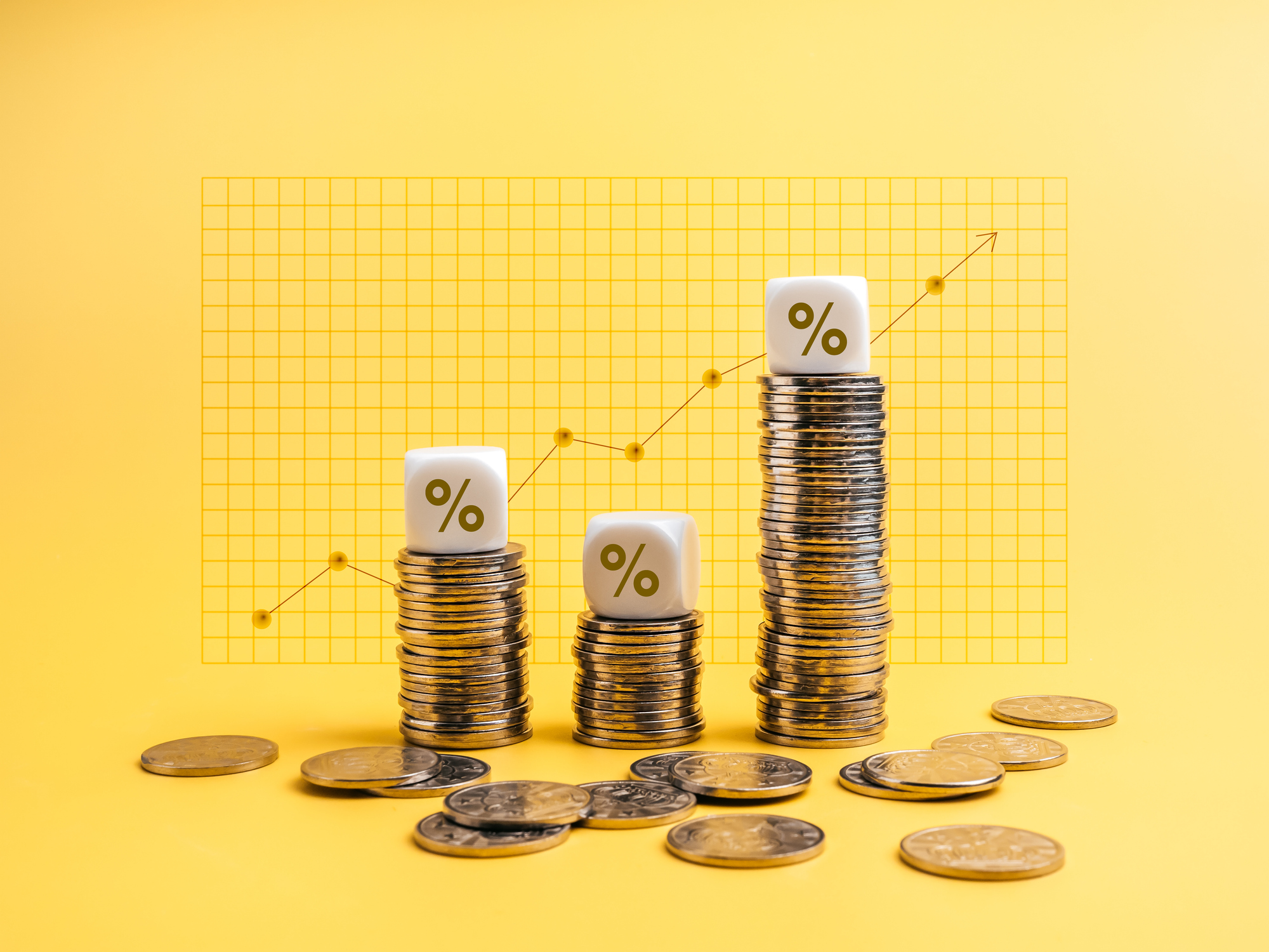 Percentage icons on white cube blocks on money coin stack as graph steps