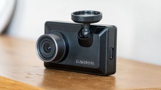 Garmin Dash Cam X310 on a wooden table