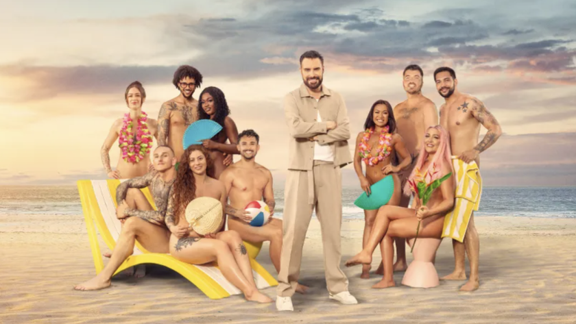 Host Rylan Clark and the Dating Naked UK season 2 cast on a beach