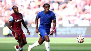 Chelsea's Axel Disasi competes for the ball with West Ham's Michail Antonio at the London Stadium in August 2023.