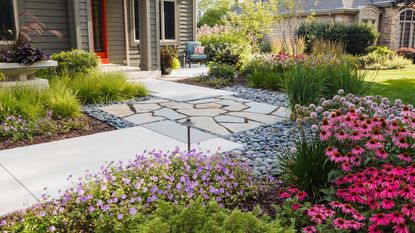 flagstone pathway in a front yard with a crazy paving section in the middle
